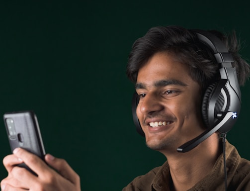 A friendly customer support agent wearing a headset, smiling and ready to assist.